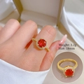Detail view of gold zircon ring with red gemstone showing weight 3.2g and size 18mm - Adjustable Open / Red Zirconia