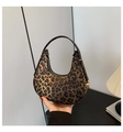 Detailed view of leopard print crescent bag with premium gold hardware and zipper - Leopard Print