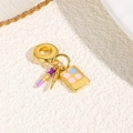 Detail of a gold charm featuring purple lipstick and colorful enamel eyeshadow palette - Makeup Expert - Purple Pink (ZYN-DME898G-3)