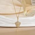 Elegant gold moon shield pendant necklace with sparkling cubic zirconia on a white background - Rhombus Crescent Moon Zirconia Style (XL0466)