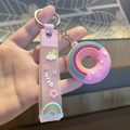 Porte-clés donut rose avec breloque arc-en-ciel et dragonne en silicone translucide - Rose