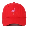 Detail shot of the pink flamingo embroidery on a classic red cotton baseball cap - Red