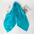Lake blue silk square scarf for women with smooth texture shown in flat lay - Emerald Green