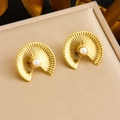 Macro shot of gold-plated fan-shaped earrings with central pearl on leather texture - Sun Fan Pearl Earrings (E6202)