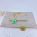Gold plated cherry blossom necklace with green enamel flower and Tai Chi motif - Green Flower Tai Chi