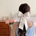 French style oversized cream satin bow hair clip with elegant long ribbons on model - Spring Clips / Gentle Beige