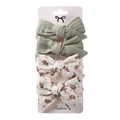 Close-up of 4-piece hair bow clip set featuring floral patterns and solid green fabric - Bean Green & Floral