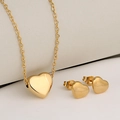 Polished gold stainless steel jewelry set featuring a heart necklace and matching earrings - Gold