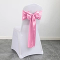 Pink satin chair sash tied in a bow over a white seat cover for wedding banquet - Deep Pink