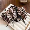 Detail of leopard print fabric hair scrunchie with black ribbon on a white jewelry tray - Leopard Cloth Ribbon Bow Style