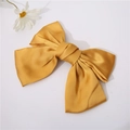 Detailed view of ginger yellow satin bow hair clip with a smooth silky texture - Ginger Yellow