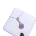 Silver necklace featuring a round pink gemstone pendant with halo crystal surround - Pink Diamond Necklace Tz-30