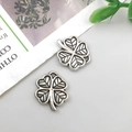 Antique silver alloy four-leaf clover pendant charms with intricate hollow-out details - Vintage Four-leaf Clover 11x13mm