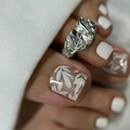 Close-up of irregular silver toe ring with white leaf pattern nail art design - No Accessories Style / X-0399 Toe White Leaf