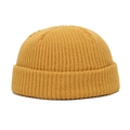 Detailed view of ginger yellow knitted beanie showing thick ribbed texture and rolled edge - 55-60 / Dark Yellow