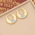 Gold U-shaped Evil Eye earrings with blue enamel center on a textured background - 2# (Gold U-Shape Blue Eye)