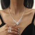 Silver-toned teardrop jewelry set with necklace and ring featuring sparkling rhinestones - V-Shape Tassel Ring Necklace Set (DTN14026189S)
