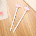 Pink heart-topped white gel pen set for school stationery on a light wooden background - White Angel Wings