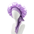 Detail of purple satin sleep bonnet featuring elastic headband and long adjustable ribbon - Light Purple