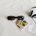 Vintage black oval cat-eye sunglasses with gradient brown lenses and Y2K aesthetic - Black Frame Tea