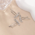 Macro detail of silver bow pendant with micro-set zircons for DIY jewelry making - Three Zirconia Bow (PJ0310) / Silver