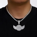 Close-up of silver hip hop necklace featuring iced out wings and round pendant on tennis chain - Silver Pendant with 18inch Tennis Chain