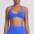 Detail of royal blue halter neck sports bra and high-waisted leggings set in studio lighting - Electric Blue