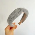 Close-up of grey plush knitted headband with trendy cross knot and fluffy mohair texture - Cross Knot / Gray