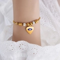 Golden bead bracelet featuring a heart-shaped evil eye pendant with sparkling rhinestones - E450-Blue Enamel Gold Color Bracelet