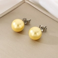 Close-up of elegant gold pearl stud earrings with steel posts on premium silk fabric - 10mm / Steel Base Yellow Faceted Crystal (KE116407-K)