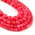 Macro view of faceted red natural stone beads with fine cut texture and gradient sizes - Faceted Deep Red Vein Chalcedony