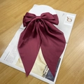 Elegant wine red satin bow hair clip with long ribbons on a minimalist magazine background - Dark Red