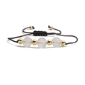 Detail of adjustable handmade rope bracelet with white stone beads and gold metal accents - White Stone
