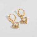 Detailed view of gold heart earrings featuring religious relief and white zircon inlay - Hollow Heart Style (ES2680镂空爱心)