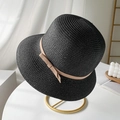 Black woven straw sun hat with bow ribbon on minimalist metal stand display - M(56-58cm) / Black