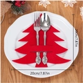 Red Christmas tree felt cutlery holder set on a white plate with wooden background - Pine Tree / Red