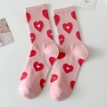 Sweet pink crew socks featuring red heart patterns and Love lettering for women - One Size / Pink Heart