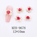 Detail of 12x10mm gold bow nail charm with a red heart rhinestone on pink manicure - Bowknot Heart Nail Art Charm (9678)
