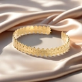 Adjustable golden open bangle with leaf-shaped textures on champagne silk background - f36 Olive Leaf Texture Style / Gold