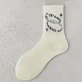 Beige cotton crew sock with black star graphics and typography detail, color option 6 - One Size / Retro Letter Style 6 (Pick Up)