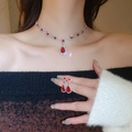 Macro shot of silver-tone necklace and teardrop earrings set with red gemstone inlay - Red Waterdrop Necklace Earring 2Pcs Set (24#)