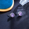 Macro detail of purple zircon stud earring with crown-shaped silver claw setting - Violet Blue 8MM