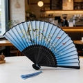 Blue folding fan with black bamboo frame featuring plum blossoms and butterfly patterns - Style 47 (New Style)