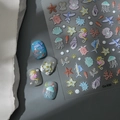 Detailed view of 5D ocean embossed nail stickers with seahorse and jellyfish motifs - Ocean Life Series (CO-530)