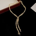 Détail d'un collier en Y à plusieurs rangs avec perles dorées et pompons élégants - 1# Collier en Y à Perles Multi-Rangs - Or (HN11091)