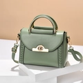 Avocado green crossbody bag with woven details, metal handle and gold twist lock - Green