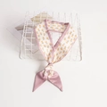 Taro purple floral skinny silk scarf ribbon tied in a bow on a white display rack - Purple Floral