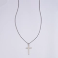 Macro view of a minimalist silver cross pendant made of polished stainless steel metal - Steel