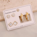 Macro detail of three-pair stainless steel earring set with heart and crystal studs - Heart Square Style (E601) / 3 Pairs Set
