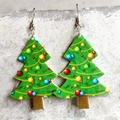 Detail of green Christmas tree earrings with colorful pattern and golden trunk details - Green Christmas Tree With Ornaments